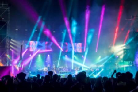 Blurred background : Bokeh lighting in outdoor concert with cheering audienceの写真素材