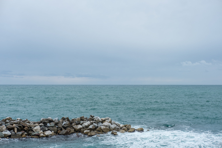 Sea waves crashing on the rock.の写真素材
