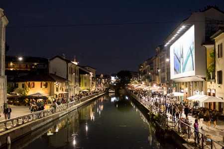 Milan, Italy - 16 September 2017: People walking around Naviglio Grande with building along the canal at nightのeditorial素材