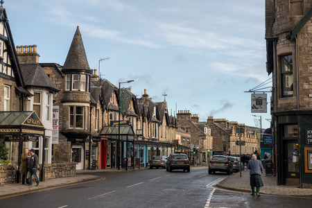 Pitlochry, United Kingdom - 10 November 2017: People walking on the main street in Pitlochry, a...