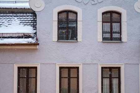 Snow falling with windows, building on the background.の写真素材