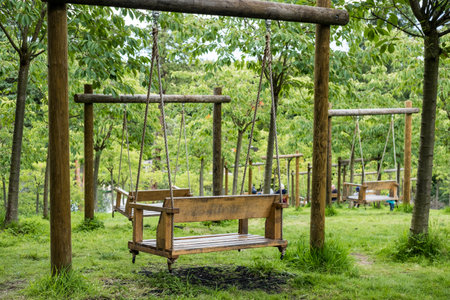 Wooden swing in Alnwick Garden, Northumberland, Englandの写真素材