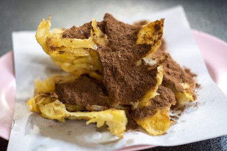 Crispy Roti with chocolate powder, served on plateの写真素材