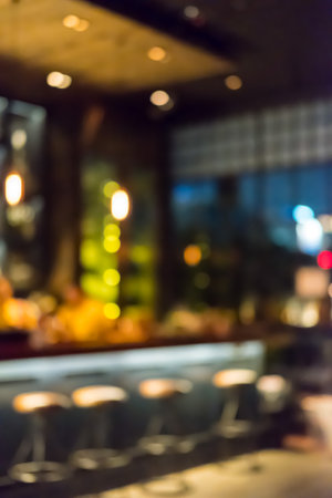 Blurred image bokeh of Seating inside the restaurant, bar counter