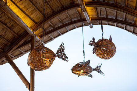 Fish-shaped hanging traditional bamboo woven lamp shadeの写真素材