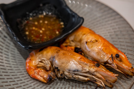 Grilled Shrimp served on plate with sauceの写真素材