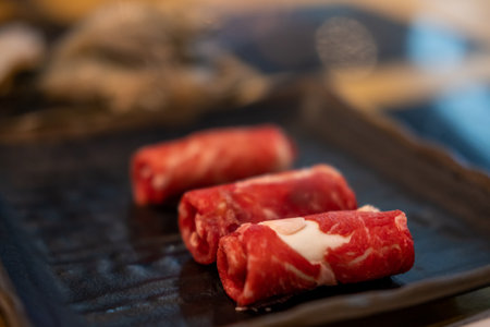 Close up of Angus Chuck Roll, raw meat ready to be cooked by hot potの写真素材
