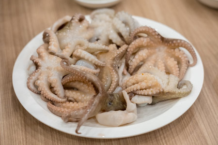 Raw squid served on plate for barbecueの写真素材