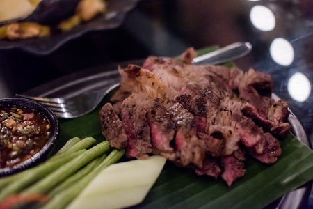 Medium rare meat served on the plate with sauce