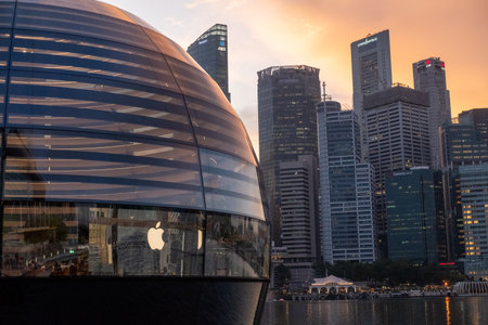 Singapore - 20 October 2022: Apple Marina Bay Sands with sunset sky. The World's First Floating Apple Store, designed by Foster + Partners.のeditorial素材