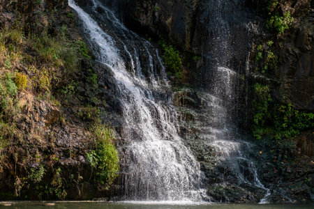Close-up of waterfall with autumn foliageの写真素材