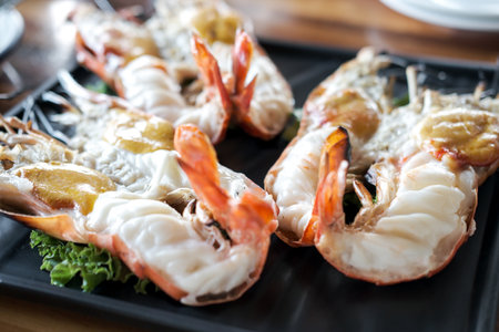 Grilled river prawns served on plate with vegetableの写真素材