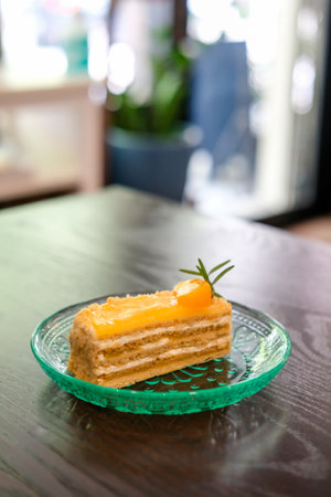 Medovik, Russian and Soviet honey cake with orange on top, served on plateの写真素材