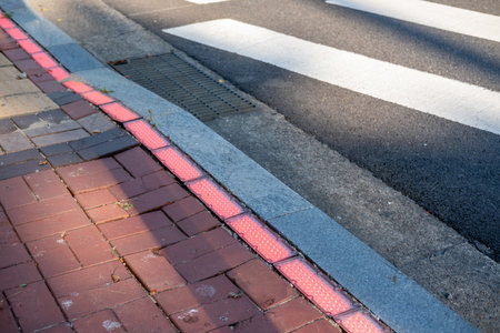 Street crossing in Seoul. The red light on the floor indicates that people cannot walk across.
