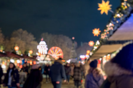 Blurred image bokeh of People walking, shopping at Winter Wonderland, a Christmas Market in Hyde Park, London.の写真素材