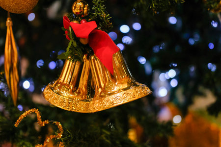 Closeup of Christmas bell ornament, tree decoration with blur bokeh backgroundの写真素材