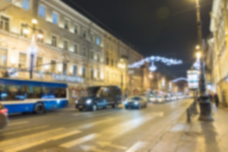 Blur image bokeh, lighting from cars and building at night in Saint Petersburg, Russia. Abstract background.の写真素材