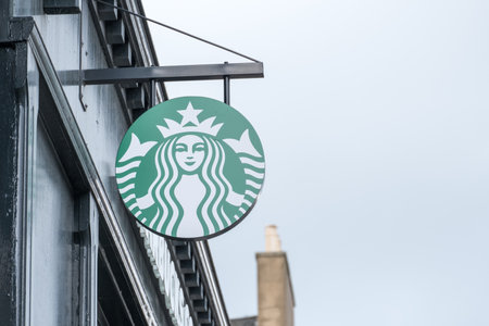 Edinburgh, United Kingdom. 17 March 2017 : Starbucks, Logo sign from exterior shop on Princes Street. Starbucks is one of the most world famous coffeehouse chains from the United States.のeditorial素材