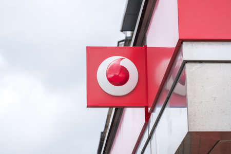 Edinburgh, United Kingdom. 17 March 2017 : Vodafone, Logo sign from exterior shop on Princes Street. It is a British multinational telecommunications company, with headquarters in London.のeditorial素材