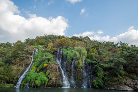 Close-up of waterfall with autumn foliageの写真素材