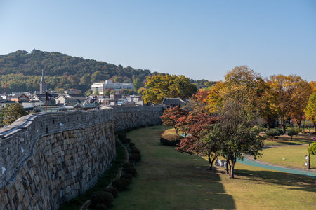 Suwon, South Korea - 29 October 2023: Suwon Hwaseong Fortress Wall, with the park view during autumn. The wall is surrounding the center of Suwon, the provincial capital of Gyeonggi-do, in South Koreaのeditorial素材
