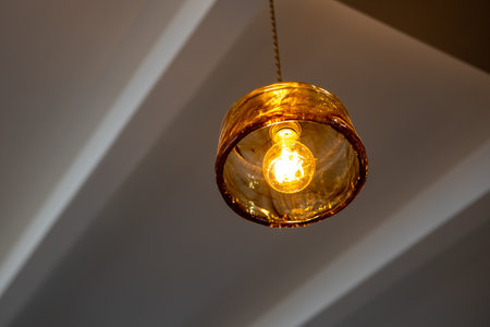 Hanging Edison light bulb, also known as filament light bulb. with glass shadeの写真素材