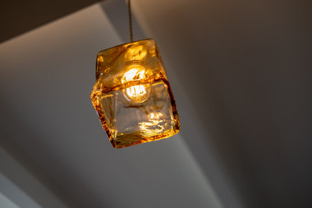 Hanging Edison light bulb, also known as filament light bulb. with glass shadeの写真素材