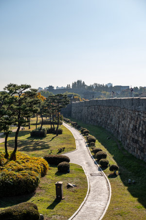 Suwon, South Korea - 29 October 2023: Suwon Hwaseong Fortress Wall, with the park view during autumn. The wall is surrounding the center of Suwon, the provincial capital of Gyeonggi-do, in South Koreaのeditorial素材