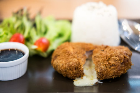 cheese tonkatsu pork cutlet with rice and vegetable set, soft focus