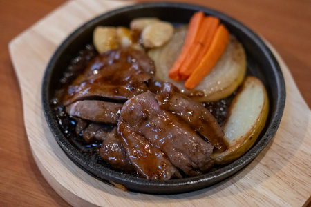 Japanese beef steak served on plate with potato and carrotの写真素材