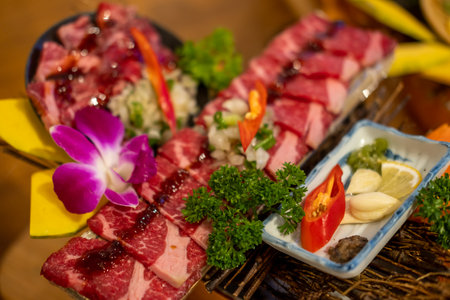 Japanese style sliced beef prepared on the plate, with flower decorationの写真素材