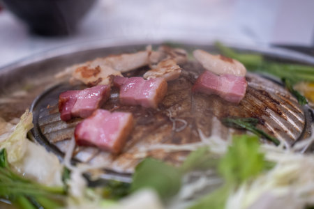 Thai style pork, bacon and seafood barbecue with vegetable soupの写真素材
