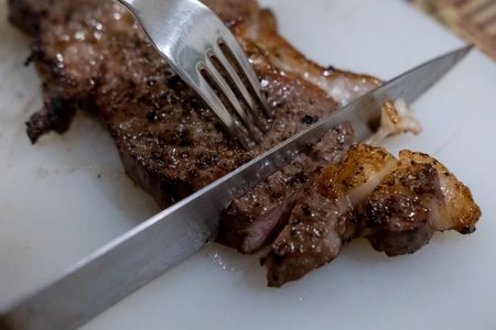 Medium rare sliced meat on the cutting board