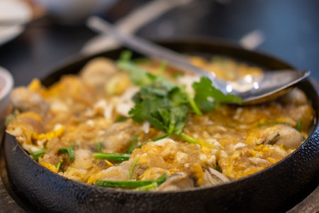 Sizzling oyster omelette served hot on a panの写真素材