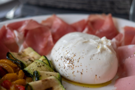 Burrata cheese served on plateの写真素材