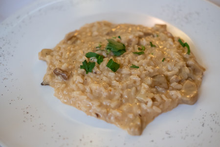 Risotto served on plate. It is a popular Italian rice dish.の写真素材