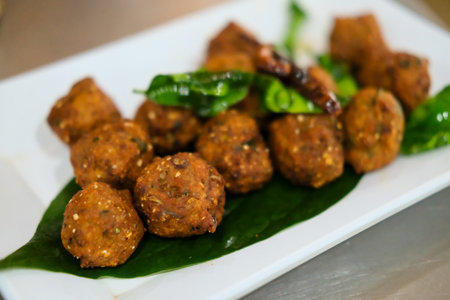 Lab Moo Tod or Crispy Larb Moo, Meatball of chopped pork mix with Thai spicy curry. Served on plate.の写真素材