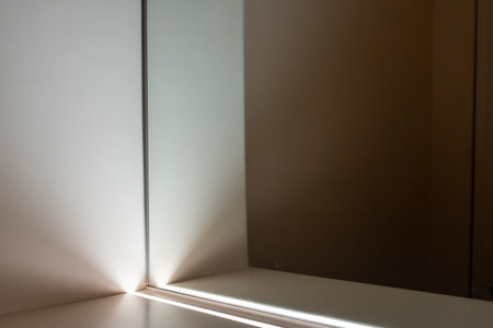 Integrated linear lighting on the cabinet, in front of the mirrorの写真素材