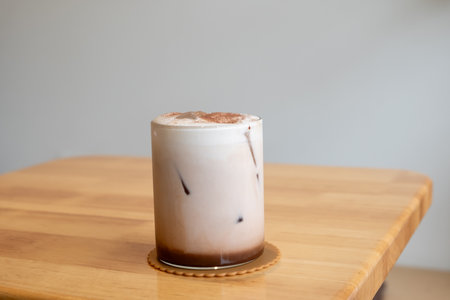 A glass of iced chocolate on the tableの写真素材