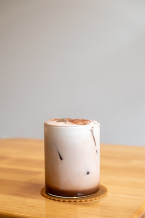 A glass of iced chocolate on the tableの写真素材
