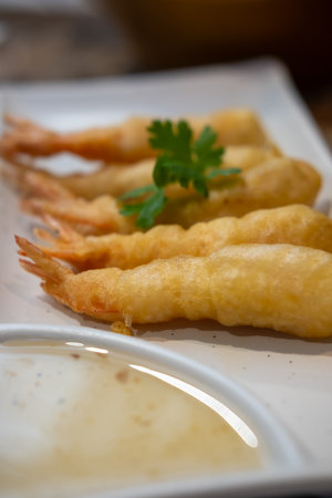 Fried shrimp served on plate with vegetableの写真素材