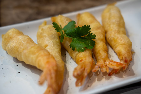 Fried shrimp served on plate with vegetableの写真素材