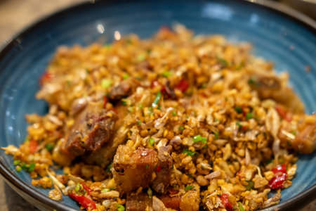 Stir Fried Crispy Pork Belly with Salt and Chili, served on plateの写真素材