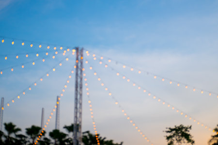Light bokeh of outdoor concert event against the skyの写真素材