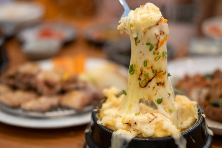 Steamed egg or Gyeran Jjim with cheese served in a bowl. Korean foodの写真素材