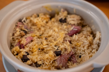 Mixed beef fat fried rice in a bowl, with sliced meat