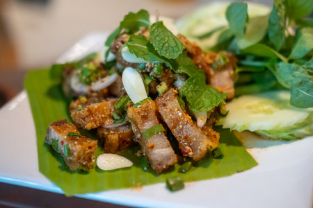 Spicy crispy pork salad or Larb. Thai food, served on plate.の写真素材