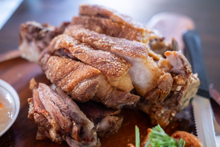 Crispy German pork knuckle served in the restaurantの写真素材