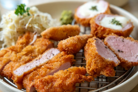 Sous vide pork katsu. Tonkatsu including loin, fillet and cheese katsu. Fried Pork serve on plate in restaurantの写真素材