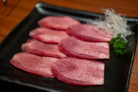 Japanese style sliced rare beef tongue meat on the plateの写真素材